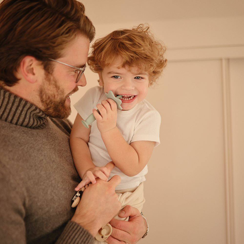 Mushie® Silikonska zobna ščetka Shifting Sand Mushie