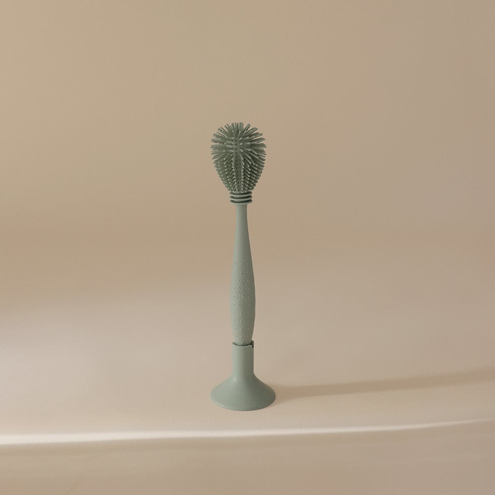 Mushie® Silikonska krtačka za čiščenje Cambridge Blue Mushie