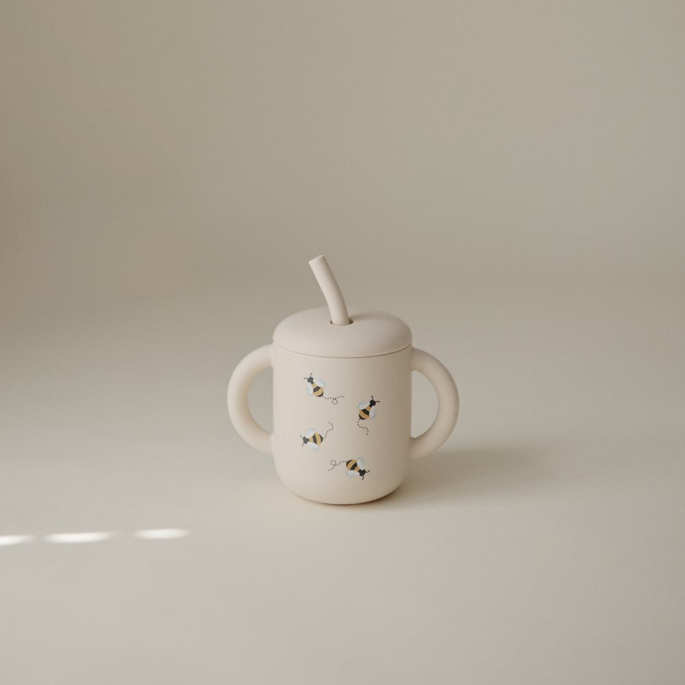 Mushie® Silikonski kozarček s slamico Bees Mushie