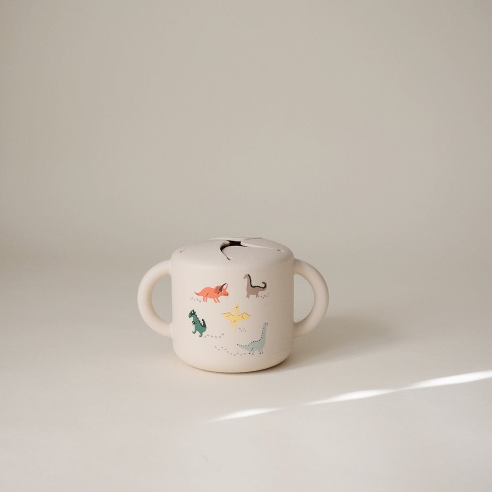 Mushie® Silikonska posodica za prigrizke Dinosaurs Mushie